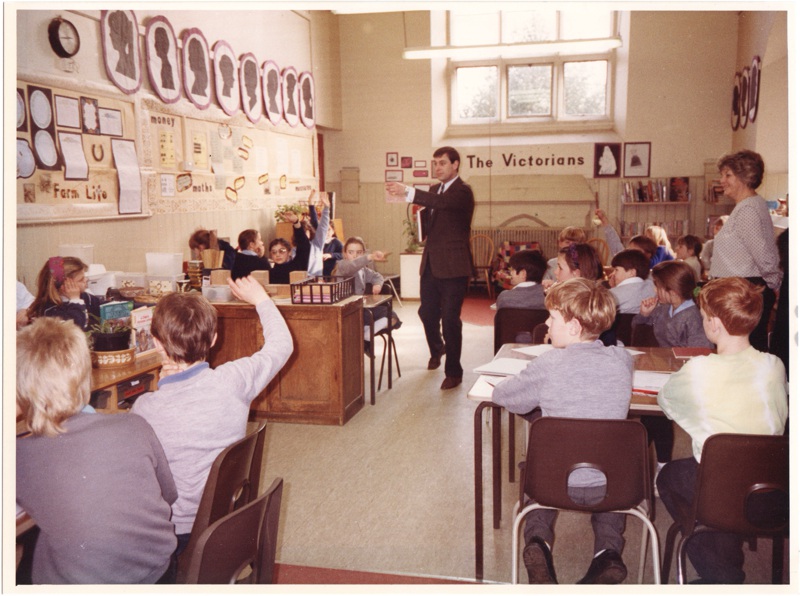 Prince Andrew talking to the children in class