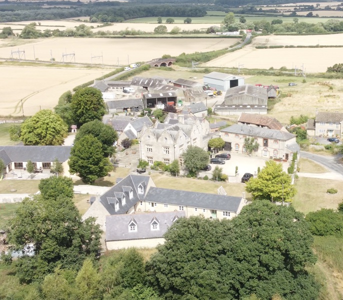 The location of the principal farmhouse and the land beyond