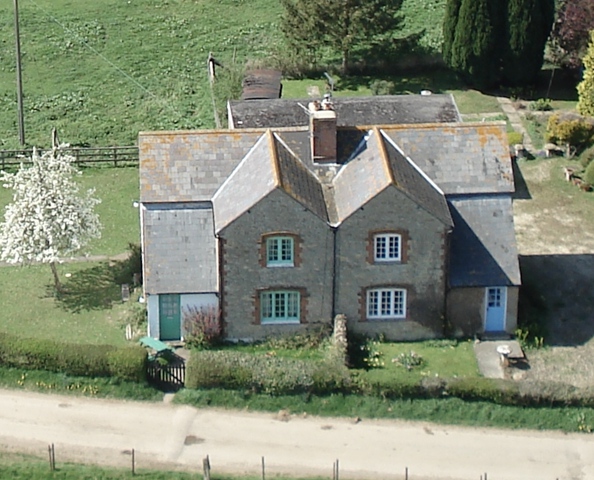 The two cottages at the entrance to West Mill Farm. Photo by Neil B. Maw